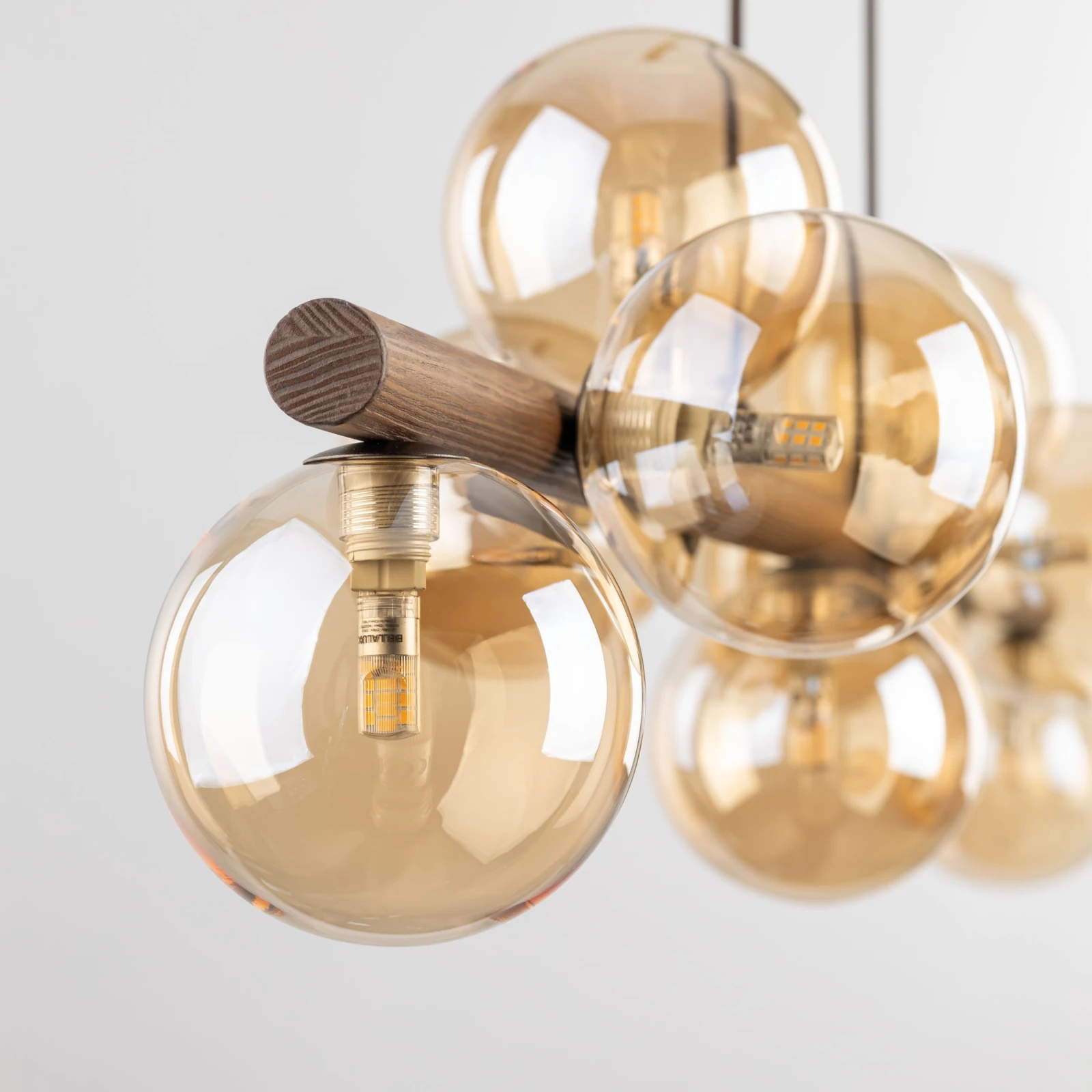 Pendant lamp 9xG9 – amber glass spheres, walnut accent